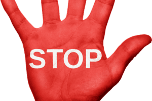 red hand with STOP