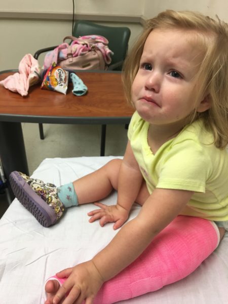 toddler in pink cast