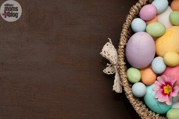 easter basket with eggs on brown background