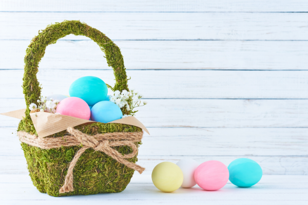 Green basket with multi-colored eggs