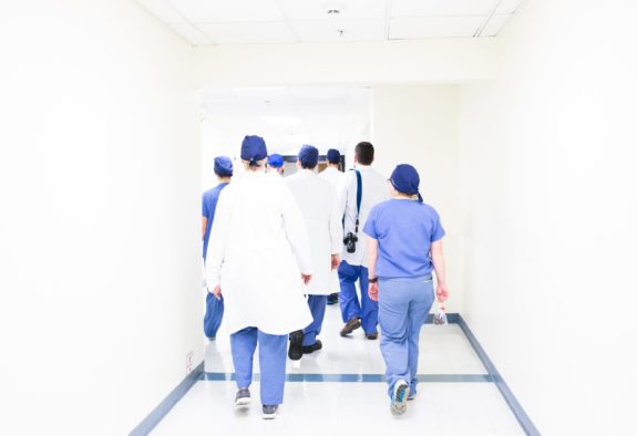 doctors in white hallway of hospital