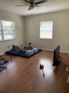 kids on floor of new home during a PCS
