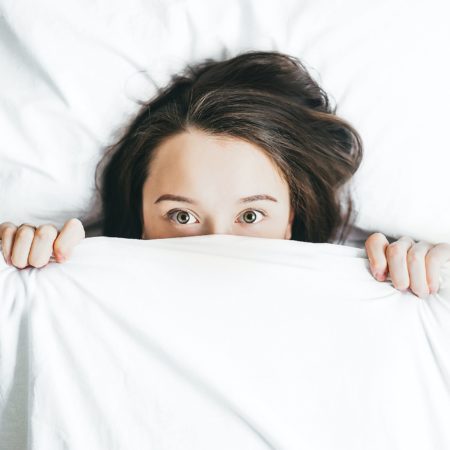 woman not sleeping in bed