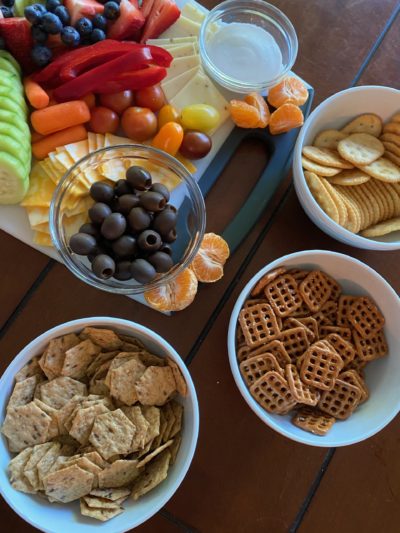snack tray with different fruits, veggies, meats, and crackers