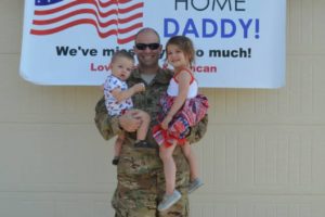 soldier welcomed home with children