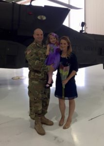 military couple with child