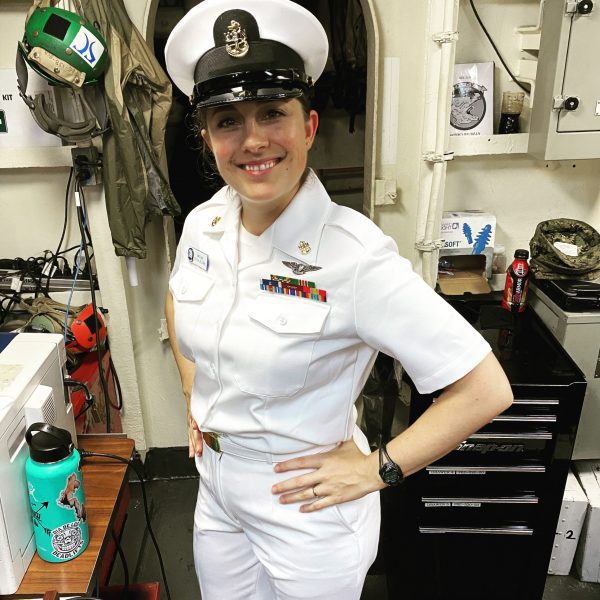 Woman in uniform on aircraft carrier