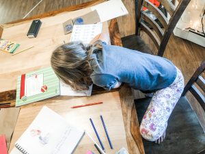 child homeschooling with supplies