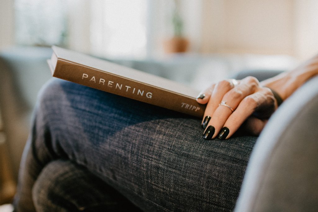 parenting book on a lap