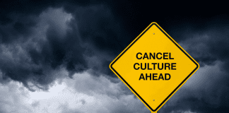 stormy background with "Cancel Culture Ahead" sign