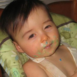 Baby with icing on face