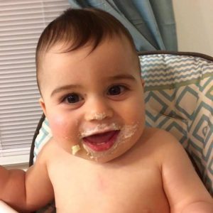 Baby with icing smeared on face