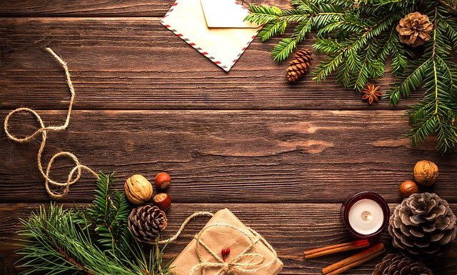 holiday tidings and presents on wood table