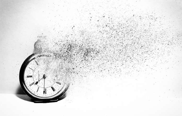 clock disintegrating to symbolize losing time