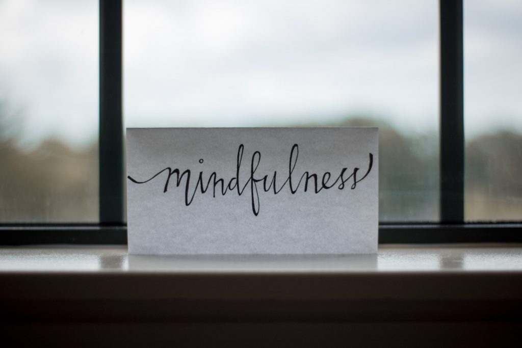 mindfulness on a note in window