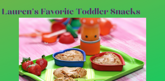Lauren's Favorite Toddler Snacks with fruit and snacks on a green tray