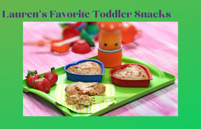 Lauren's Favorite Toddler Snacks with fruit and snacks on a green tray