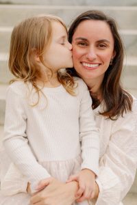 Daughter kissing mother's cheek