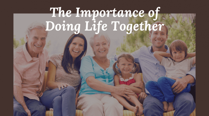 Multigenerational family portrait in grayscale with "The Important of Doing Life Together" in text