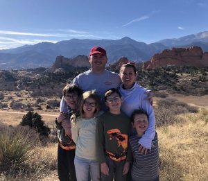 family standing at overlook of Garden of the Gods
