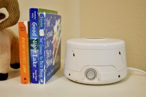 Dohm sound machine sits on table next to kid books (for Friday Favorites)