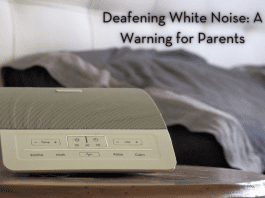 a white sound machine next to a bed with the words "Deafening White Noise: A Warning for Parents" in text