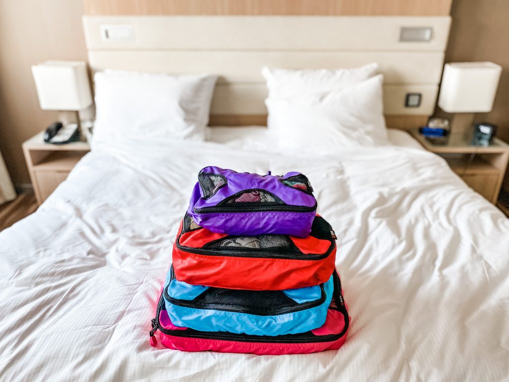 packing cubes on a bed