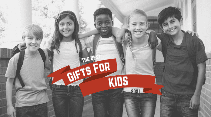 group of children with "Gifts for Kids 2021" on red holiday ribbon