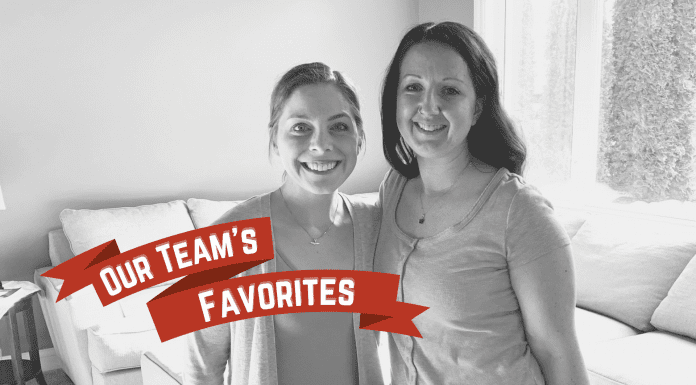Amie Glazier + Rachel Carpenter, co-owners of The Military Mom Collective with "Our Team's Favorites" on a red holiday banner