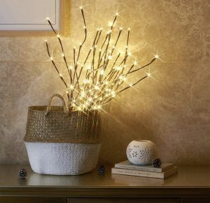 twinkling twig lights in a basket to create a cozy atmosphere