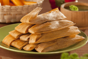 tamales on a green plate