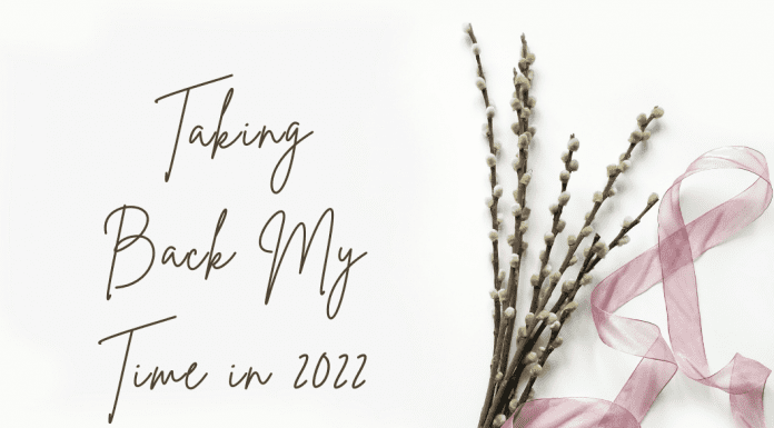 delicate flowers with a pink sheer ribbon and "Taking Back My Time in 2022" in text with MMC logo
