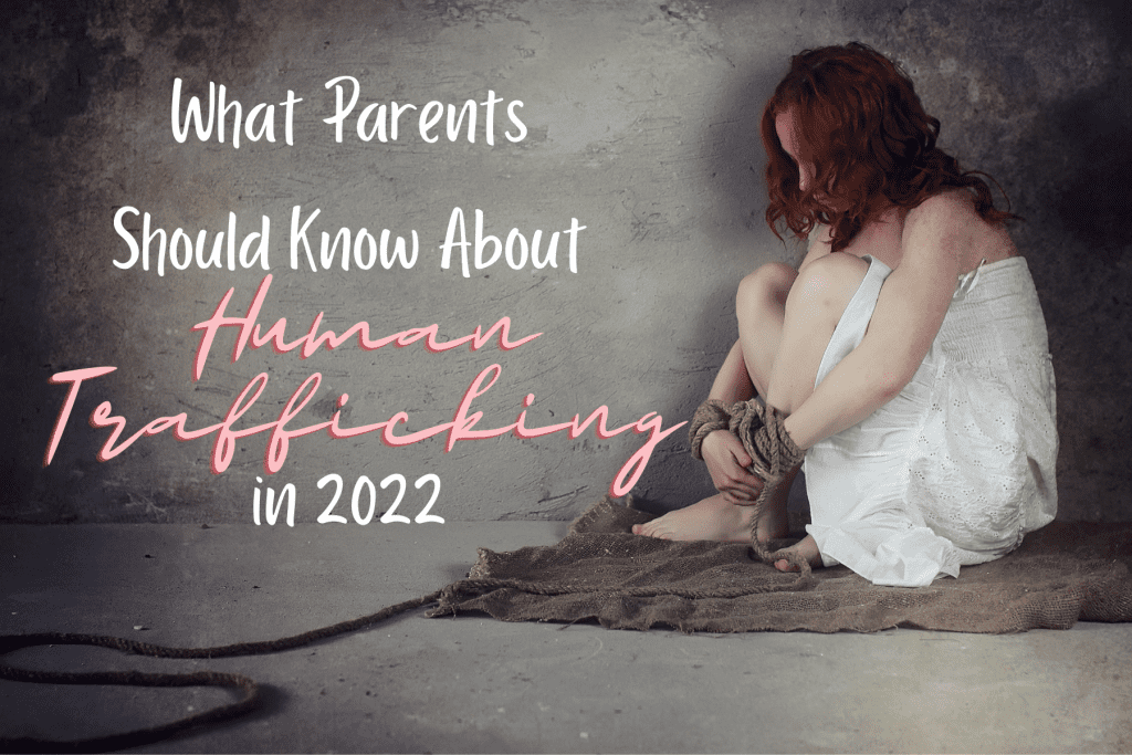 What Parents Should Know About Human Trafficking in 2022 in text with a young girl in chains cowering on a floor