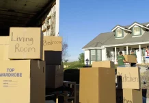 moving boxes outside a house on a sunny day