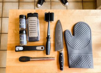 various kitchen tools on a butcher block