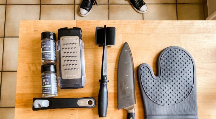 various kitchen tools on a butcher block
