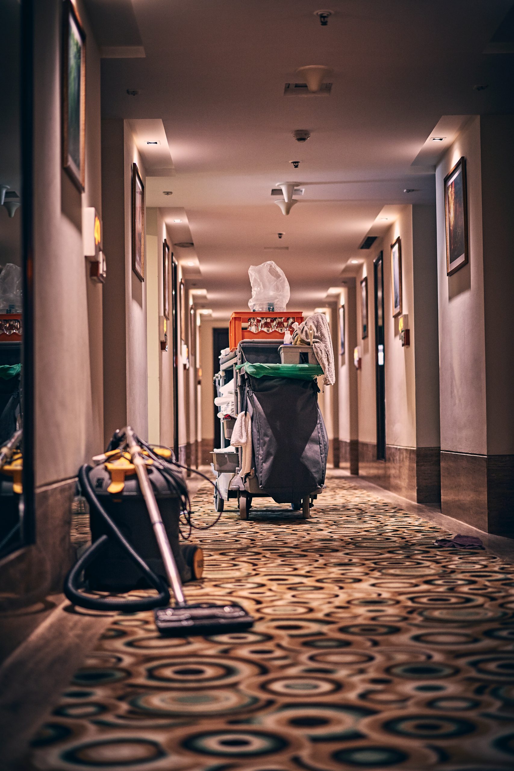 hotel hallways with cleaning supplies and cart