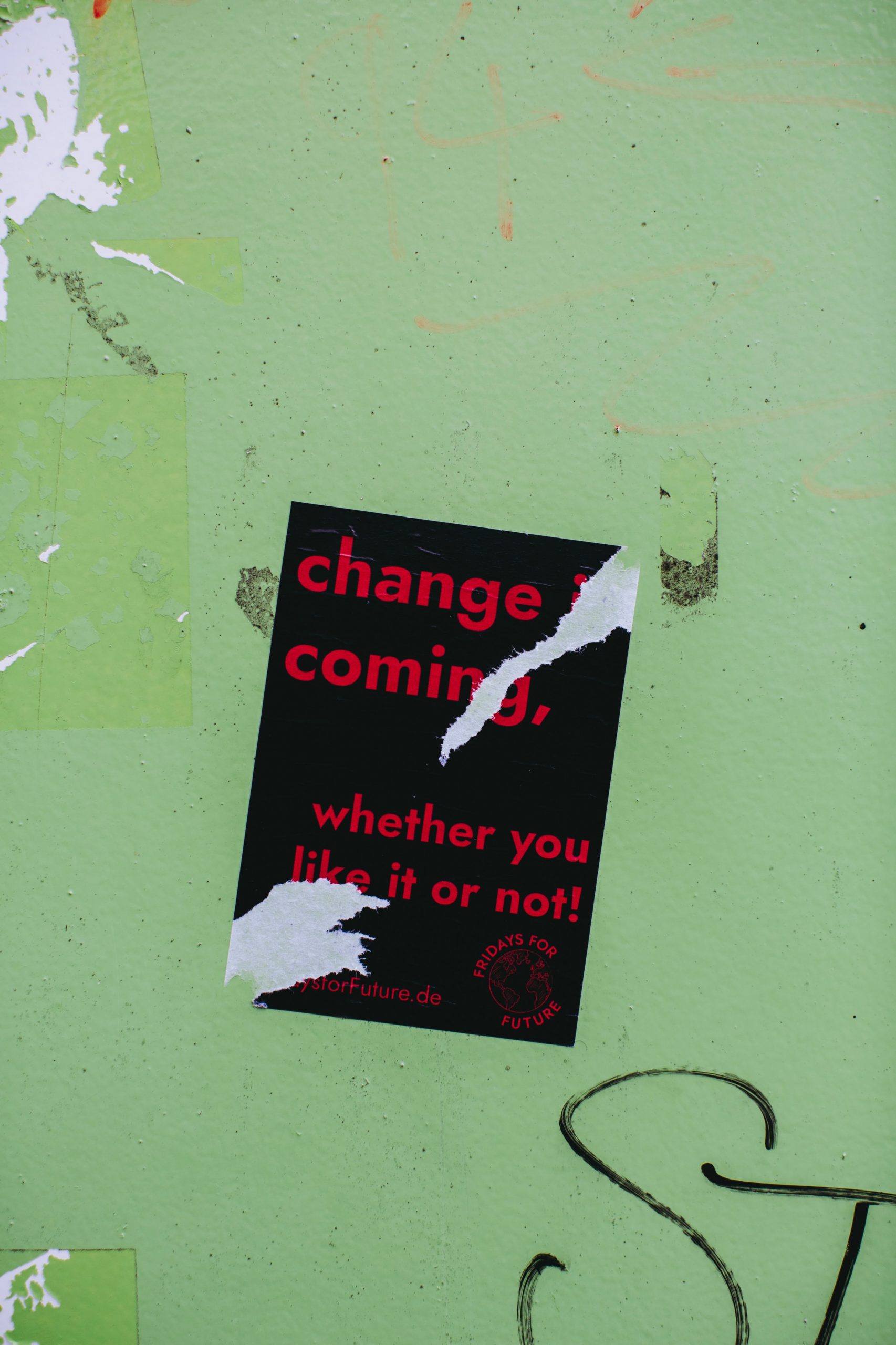 black and red book with "Change Is Coming, whether you like it or not!" in text on cover