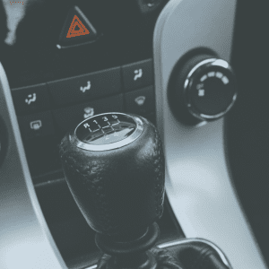 black manual stick shift in car