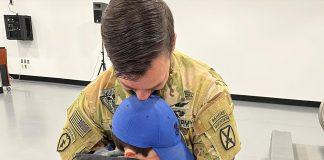 Child saying goodbye to father before deployment