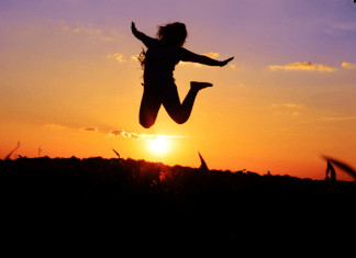 Person Jumping happily as the sun sets