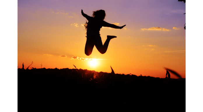 Person Jumping happily as the sun sets